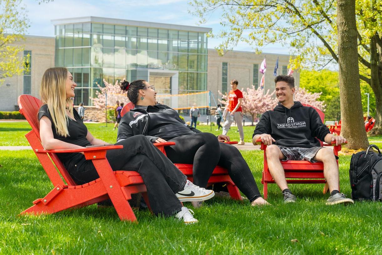 Students sitting outside in the Blue Bell campus quad area